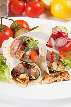 Grilled chicken and salad in tortilla wrap