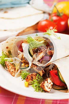Grilled chicken and salad in tortilla wrap