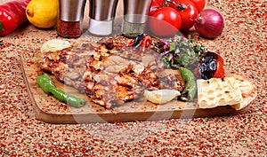 Grilled Chicken Serving on White Plate with Fresh Pepper and Salad with Fresh Vegetables