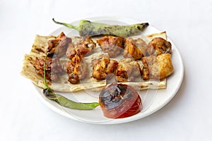 Grilled chicken shish kebab in white plate