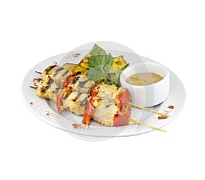 Grilled chicken skewers with potatoes and sauce