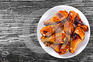 Grilled chicken sticky drumsticks marinated with honey and ginger, top-view