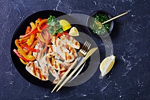 Grilled chicken tenders with peppers, top view