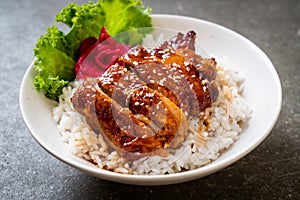 grilled chicken with teriyaki sauce on topped rice