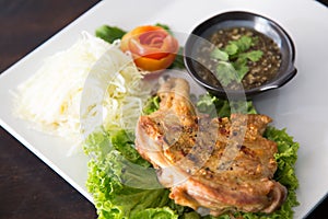 Grilled chicken with Thai style dipping spicy sauce for roasted or grilled food fish sauce and chilli