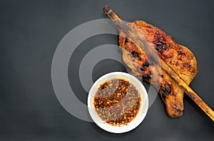 Grilled chicken with Thai style dipping spicy sauce for roasted or grilled food fish sauce and chilli