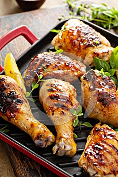 Grilled chicken thighs and drumsticks with honey glaze