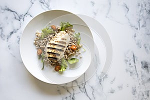 Grilled Chicken and Wholegrain Salad on a Marble Background