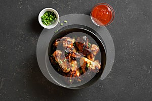 Grilled chicken wings in bowl