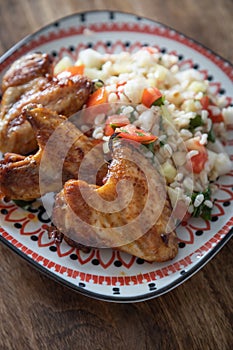 Grilled chicken wings with bulgur salad