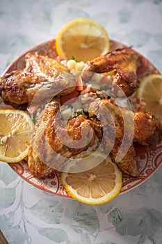 Grilled chicken wings with bulgur salad