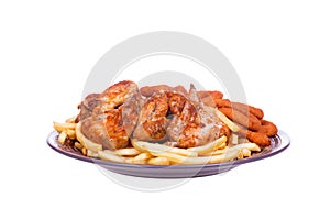 Grilled chicken wings with French fries and onions rings