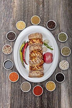 Traditional Turkish Cuisine, Grilled chicken wings baking on wooden background, top view