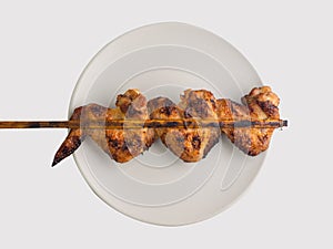 Grilled  chicken wings on white background