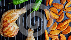 grilled cooked chicken thighs legs on grill, barbecue. outdoor. hot cast iron grate. Close up.