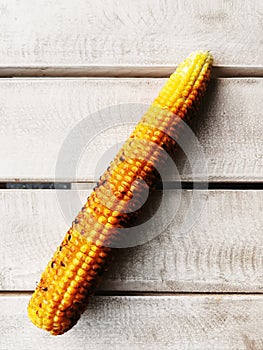 Ear of grilledcorn on a table