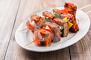 Grilled cottage cheese or also known as Paneer Tikka Kebab or chili paneer or chilli paneer or tandoori paneer in india India, bar