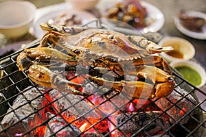 Grilled crab on a flaming grill