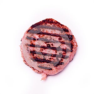 Grilled crocodile meat burger isolated on a white studio backgr