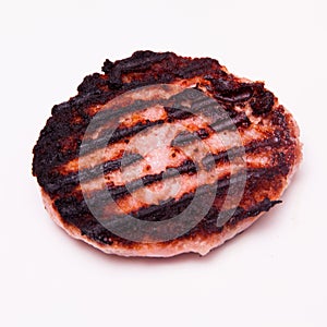 Grilled crocodile meat burger isolated on a white studio backgr