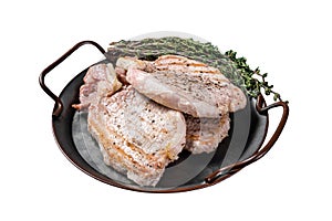 Grilled delicious pork chop steaks with herbs and spices. Isolated on white background. Top view.