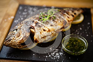 Grilled dorada fish with lemon and spinach