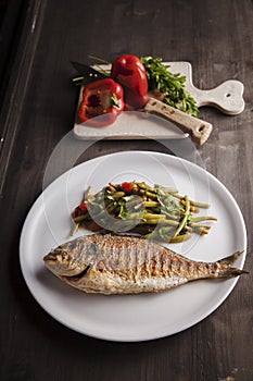 Grilled dorada fish with steamed green beans