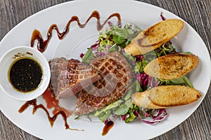 grilled duck breast with honey sauce and salad