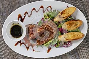 grilled duck breast with honey sauce and salad