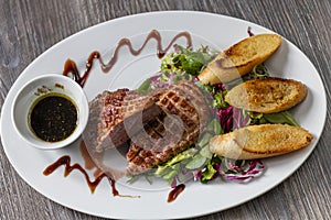grilled duck breast with honey sauce and salad
