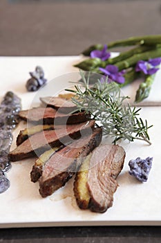 Grilled duck breast with rosemary