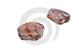 Grilled fillet mignon or tenderloin beef steak on kitchen table. Isolated on white background.