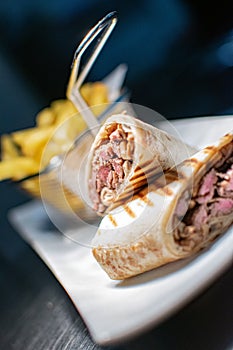 Grilled fillet steak wrap served with french fries