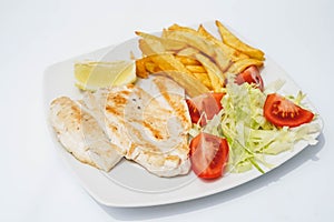 Grilled filleted chicken breast, with lettuce and tomato salad