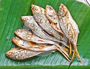 Grilled fish on banana leaf food.