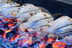 Grilled fish with flames