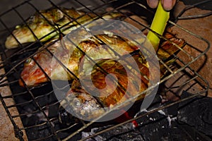 Grilled fish Nile Tilapia on charcoal grill grilled fish Nile Tilapia on charcoal grill.