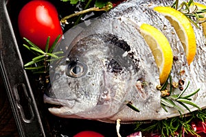 Grilled fish with roasted potatoes and vegetables.