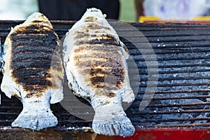 Grilled fish with salt Placed on a tribal stove