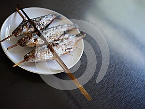 Grilled Fish skewers in Mekong River . THAIFOOD