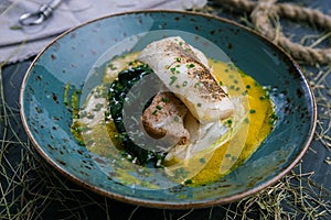 Grilled fish steak with vegetables dish from the restaurant