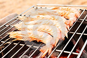 Grilled fresh prawns on flaming seafood