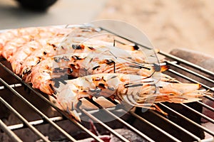 Grilled fresh prawns on flaming seafood