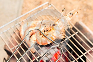 Grilled fresh prawns on flaming seafood