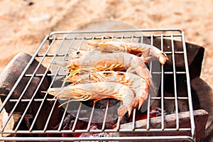 Grilled fresh prawns on flaming seafood