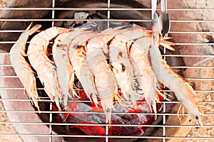 Grilled fresh prawns on flaming seafood