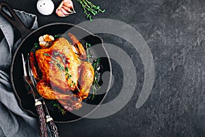 Grilled fried roasted whole Chicken in cast iron pan