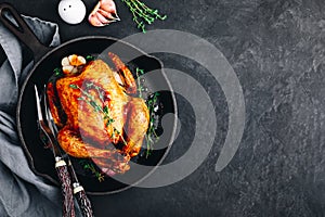 Grilled fried roasted whole Chicken in cast iron pan photo