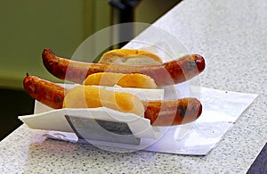 Grilled German Bratwurst sausages with piece of bread