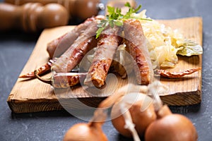 Grilled german sausage links with sauerkraut